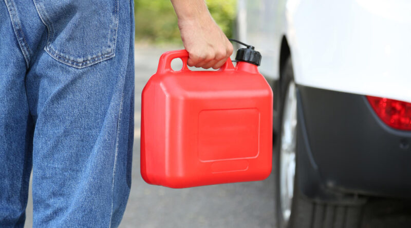 Man handling fuel tank
