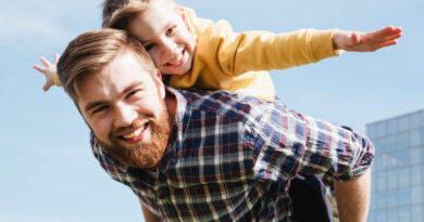 cheerful-bearded-father-having-fun-with-his-little-son