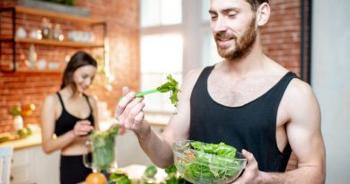 Young Sports Couple Having Snack With Healthy Salad Green Smoothie Kitchen Home