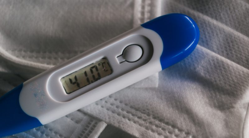 medical-thermometer-indicating-high-temperature-face-masks-coronavirus